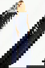 Off shoulder cape gown embellished with scattered crystal appliqués, creating a sophisticated and regal evening look.