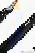 Off shoulder cape gown embellished with scattered crystal appliqués, creating a sophisticated and regal evening look.