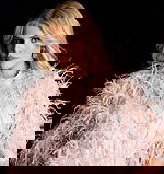 Sparkling evening gown with cape overlay and feather trim