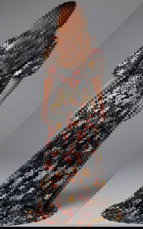 Floral V neck gown with puff sleeves and flowing silhouette