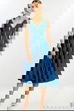 Front view of sleeveless denim midi dress with plunging neckline and zipper accents