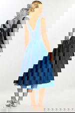 Back view of denim dress with V-shaped back and vertical zipper details