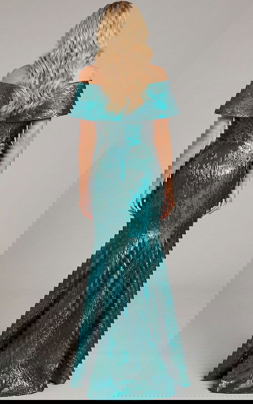 Floor length fitted gown with clean back and smooth flared hem