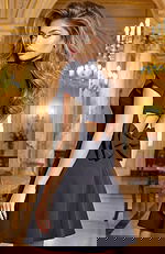 Short black dress with open back detail and bow accent