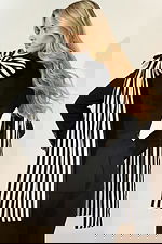 Stylish black suit with bold striped bow and crystal button details