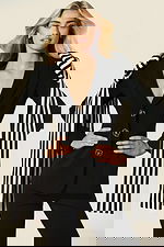 Elegant women’s tailored suit featuring statement striped accents