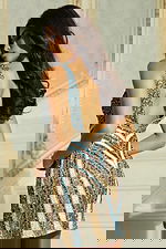 Back view of fitted beaded short dress with chevron pattern