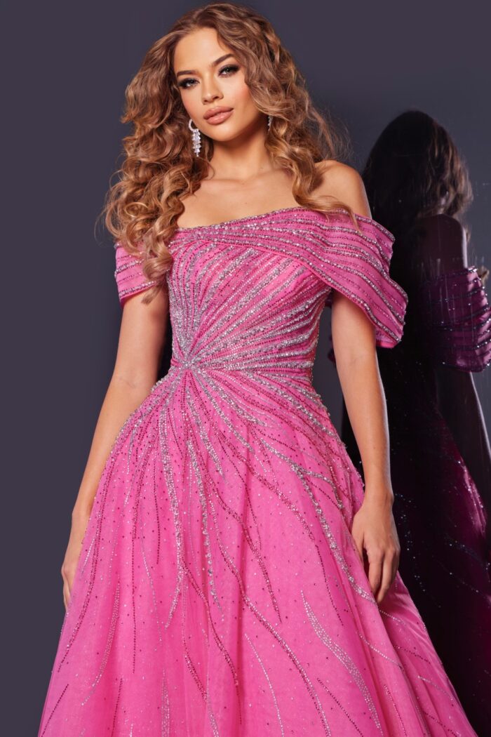 Model wearing Jovani 45067 fuchsia gown with detailed bodice and off-the-shoulder sleeves, close-up front view.