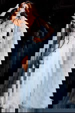 Glamorous beaded evening gown with illusion bodice and long draped cape