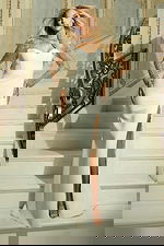 white high slit dress with embellished sleeves