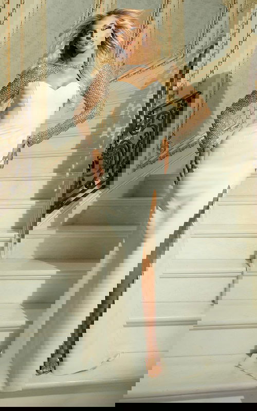 white high slit dress with embellished sleeves