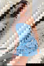 Ruched blue mini dress with ruffled skirt and bow