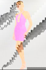 Side view of fuchsia halter dress with teardrop cutout detail