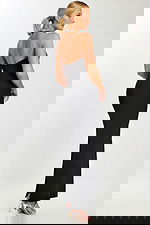 Back view of black evening dress with strapless zipper closure and floor-length hem