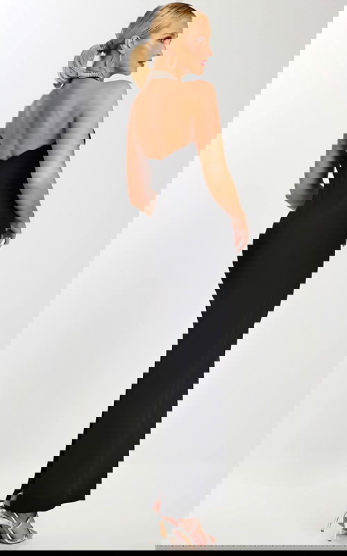 Back view of black evening dress with strapless zipper closure and floor-length hem