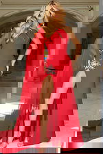 One shoulder gown with crystal embellishments and cape sleeve