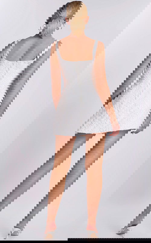 Back view of short floral lace dress with thick straps and square back neckline