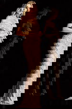 Glamorous floor length gown featuring off shoulder straps and thigh high slit