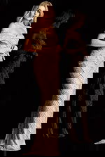 Glamorous floor length gown featuring off shoulder straps and thigh high slit