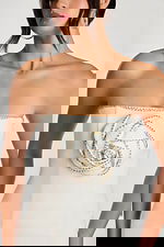 Close-up of 3D beaded rose detail on off-white mini dress