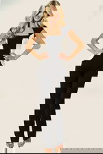 Elegant color-block jumpsuit with cap sleeves and straight legs