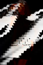 Chic short white dress with beaded pocket trim and high neckline