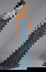 Back view of one shoulder fully beaded gown with fitted silhouette and train