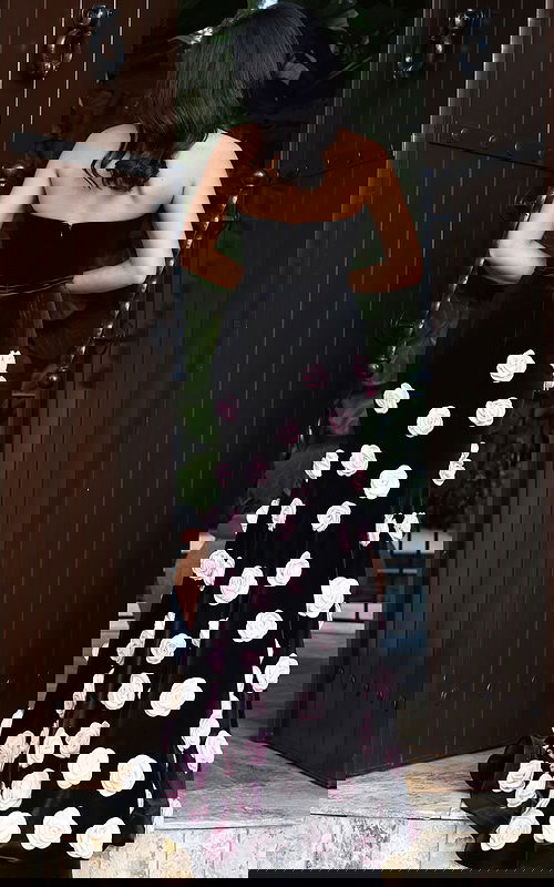 Black strapless gown with pink rose embellishments