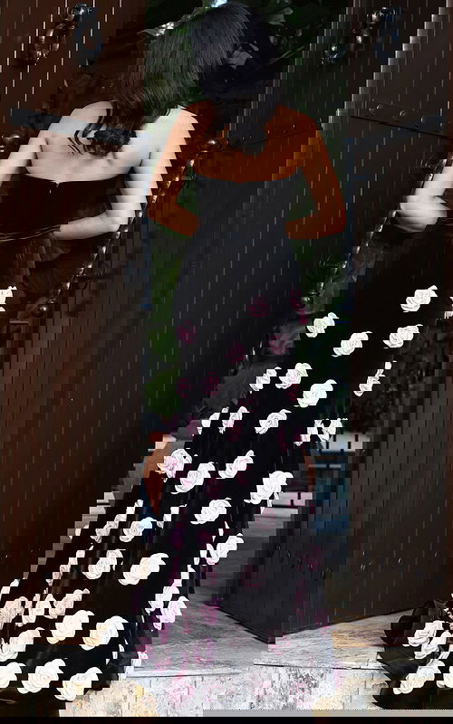 Black strapless gown with pink rose embellishments