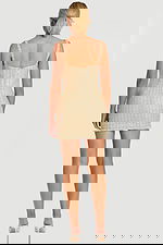 littering Champagne Tweed Ensemble with Decorative Buttons