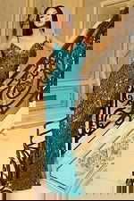 Elegant sequin gown with spaghetti straps and shimmering details