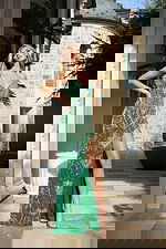 Glamorous green fitted evening gown with sequin floral patterns