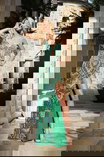 Elegant open-back prom dress with shimmering beadwork