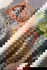 Front view of floral-accented metallic cut-out party dress