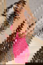 Back view of lace-up sequin mini dress with radiant beading