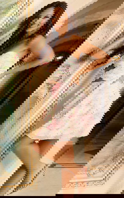 Strapless floral print dress with ruffle skirt and cutout