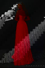Red lace evening gown featuring lace-up back and flowy skirt