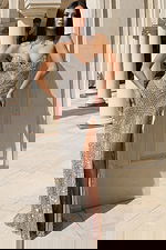 Silver beaded strapless gown with intricate pattern and high slit