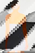 Back view of strapless fitted black short dress with invisible zipper