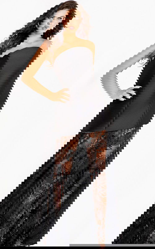 Strapless black gown with a structured mini overlay and sheer lace embroidered skirt creating a dramatic layered effect.