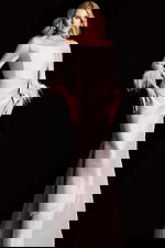 Elegant long evening dress featuring fitted bodice and flared hemline