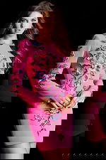 Bright pink embellished dress with intricate beaded flower patterns