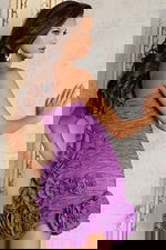 Back view of ruched mini dress with floral appliqués