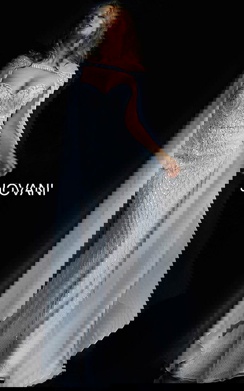 Model wearing Jovani 45566 ivory gown with sweetheart neckline and cape