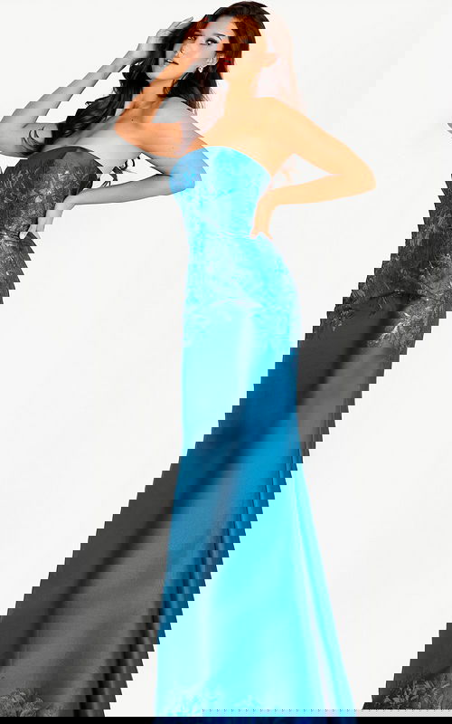 Strapless teal gown with a metallic floral jacquard bodice and smooth satin skirt, paired with dramatic off-shoulder draped sleeves for a refined and luxurious look.