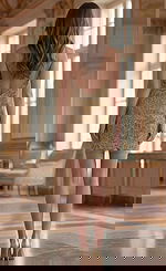 Back view of Jovani 45603 gold beaded mini dress showing low V-back with thin spaghetti straps, zipper closure, and allover floral bead embellishment on sheer mesh.