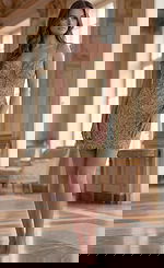 Jovani 45603 gold beaded short cocktail dress with spaghetti straps, plunging illusion neckline, and intricate floral beadwork over a nude mesh underlay.