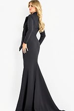 Long sleeve fitted gown with structured shoulders and a sweeping train, offering a sleek and sophisticated evening silhouette.