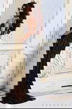 Black evening gown with plunging neckline and fitted silhouette