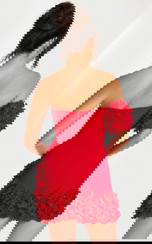 Back view of strapless red mini dress with floral hem